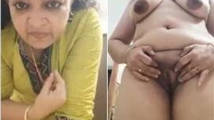 Horny aunt Mallu shows off her big tits and pussy