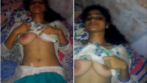 Indian fellow plays with her juicy XXX tits until she notices camera