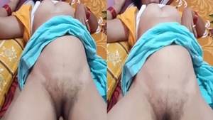 Mature Desi woman masturbates on camera