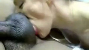 American girl gives Indian guy a sensual blowjob in this video