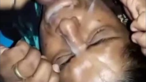 Cum-covered face of an Indian auntie in a steamy sex video