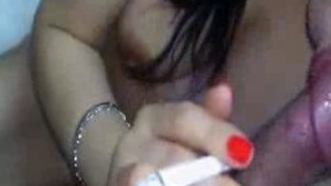 Sexy Indian beauty gives a steamy blowjob and smokes in this video