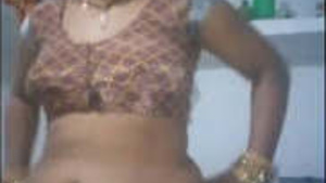 Desi Bhabhi Shows Off Her Big Breasts and Curvy Butt