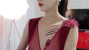 Korean babe with big boobs puts on a seductive show for the camera