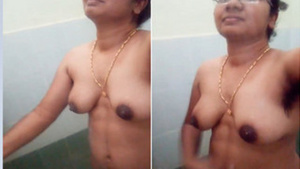 Naked Desi aunty with sexy glasses shows hairy armpits in the shower