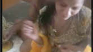 Indian housewife gets naked and receives a facial cumshot