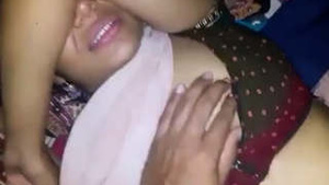 Satisfied by her sari-wearing sister-in-law