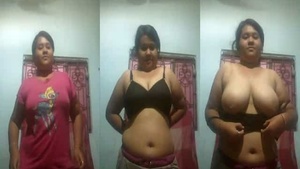 Watch this Indian babe show off her big boobs in a seductive striptease