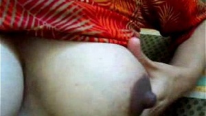 My real Indian sister is milking her tits in front of me.