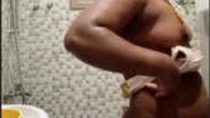 Tamil auntie putting on clothes after bathing
