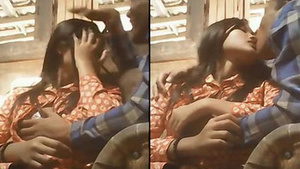 Lovebirds steal a kiss and feel each other up in a restaurant.