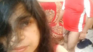 This is a middle age Indian couple that Toggle through the couch and the bedroom.