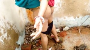Desi mother seduces her son and fucks him in the barn outdoors.