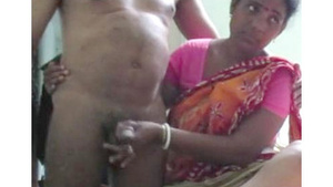 Indian maid pleases her owner by giving him a hand job.