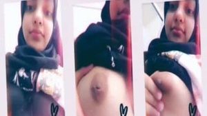 A beautiful devout Muslim woman who covers her body shows her big boobs on webcam