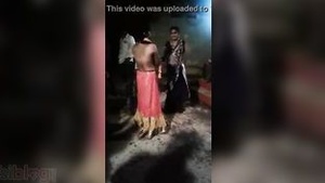A skin-tight movie of a naked hot chick dancing in public in a village.