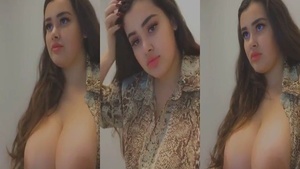 This is a video of a beautiful woman who shows her big natural boobs in a series of self-portraits.