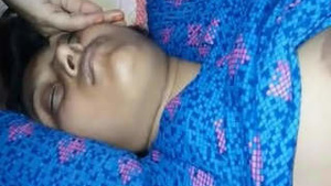 Desi bhabhi caught in the act while she is asleep.