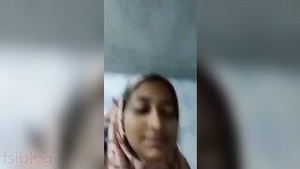 A Muslim house wife undresses and exposes her charms on camera.