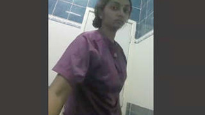Hot girl in the bathroom in a solo performance in a video.