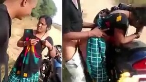 Young beauty caught in the act with a black man near a motorbike in a homemade video.