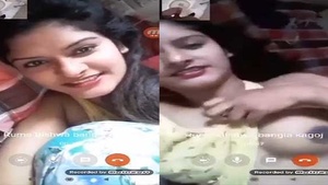 A beautiful college student shows her breasts during a video call.