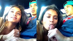 A sexy woman giving a blow job to her boyfriend in the car during their break.