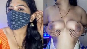 Steamy webcam performance of the Apparently Boring Indian Housewife with great booby show.