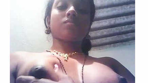 Naked girl with hard nipples and great tits pleases herself.