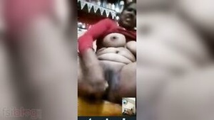 Young Indian man masturbates while watching his curvaceous and horny bhabhi to masturbate on a video call.