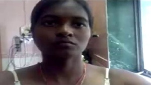 Beautiful Tamil woman opens up her beautiful big boobs and gets naked for Chez Videos.