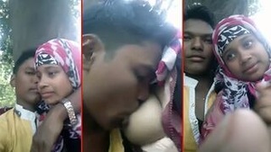 A Tamil man stimulates a woman’s nipples until they become erect while they have sex outside.