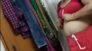 Mature woman changing her dress showcases her big knockers