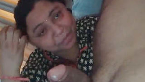 An Indian wife gives a blow job and talks at the same time.