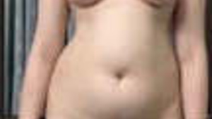 A Pakistani woman stripping for her boyfriend in a video that she sent to him.