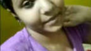 A beautiful Indian girl performing during a video call.