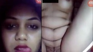 Hot girl enjoying solo pleasure by fingering herself.