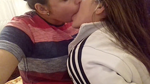 Two hot girls sexuallyexchange saliva by deep kissing each other.