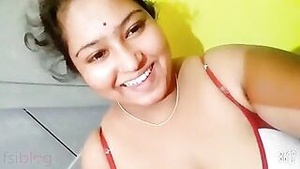 Beautiful Indian housewife shows her great body in a homemade video.