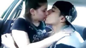 A romantic moment of a couple, who kiss each other on the lips.
