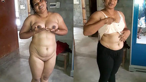 A woman poses completely naked for her husband who is taping her.