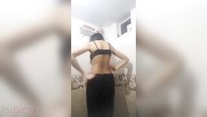 A striking Indian woman undresses to reveal her beautiful body in this solo performance.
