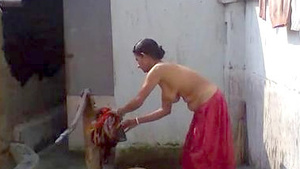 Indian maid cleaning the bathroom