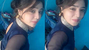Beautiful Indian woman takes a sexy self-portrait in a revealing garment.