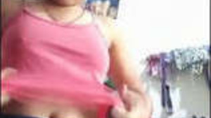 This is a nude selfie of a cute Indian girl.