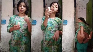 Naughty indian village girl eating banana in front of the camera.