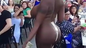 A black striptease performer in a white female league