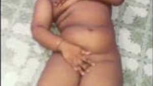Married Indian aunt undresses in this video.