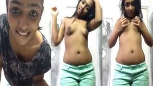 Beautiful woman from Sri Lanka performing a strip tease dance for her lover.