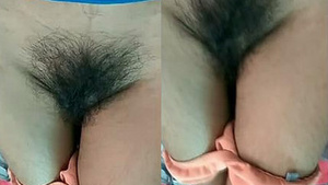 Young beautiful Indian woman showing her wet and hairy genitals.